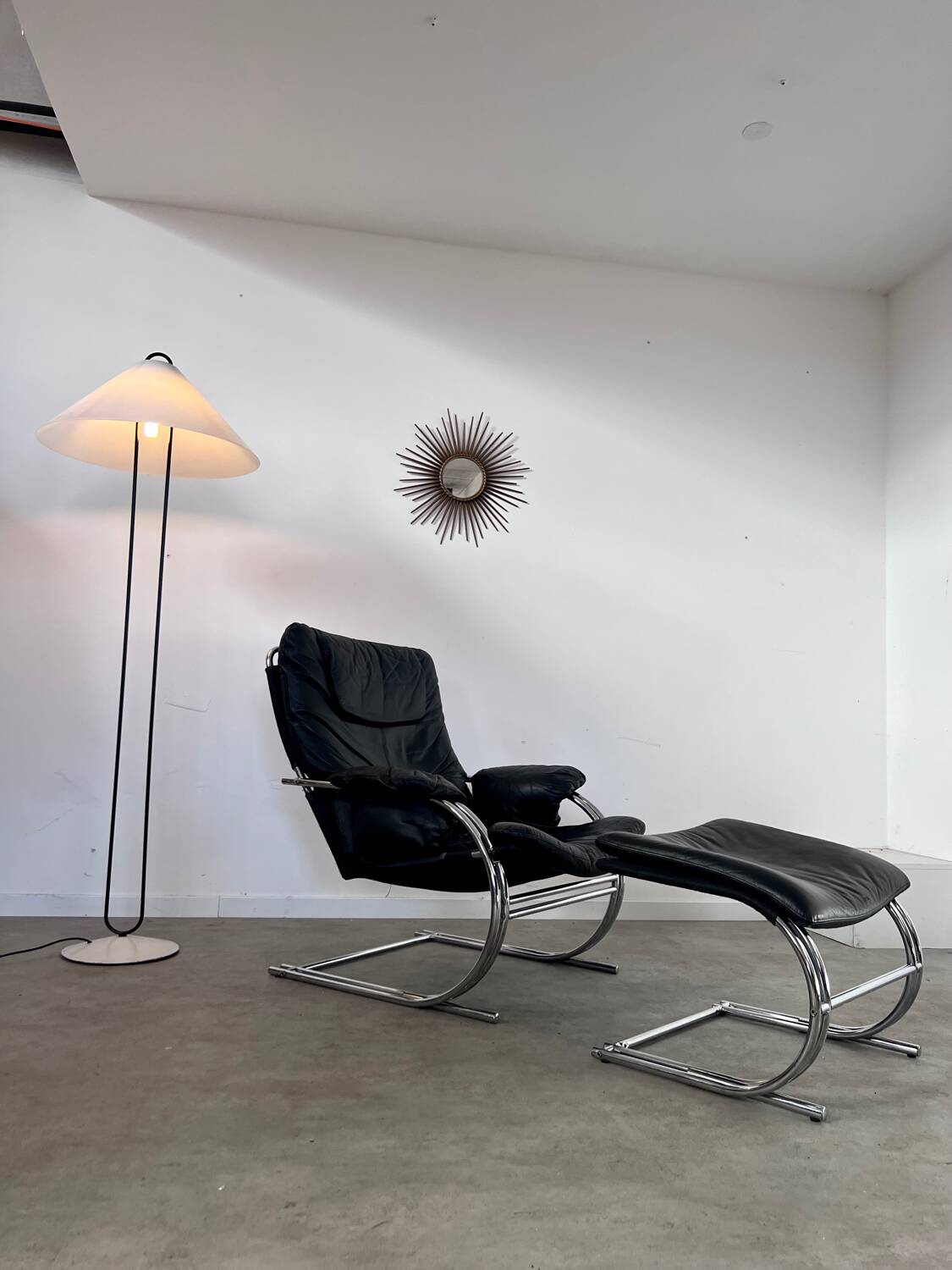 Old armchair and ottoman black leather tubular chrome bauhaus design from the 70s