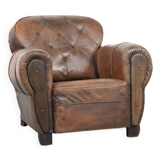 Antique sheepskin armchair with a luxurious look and finished with wood