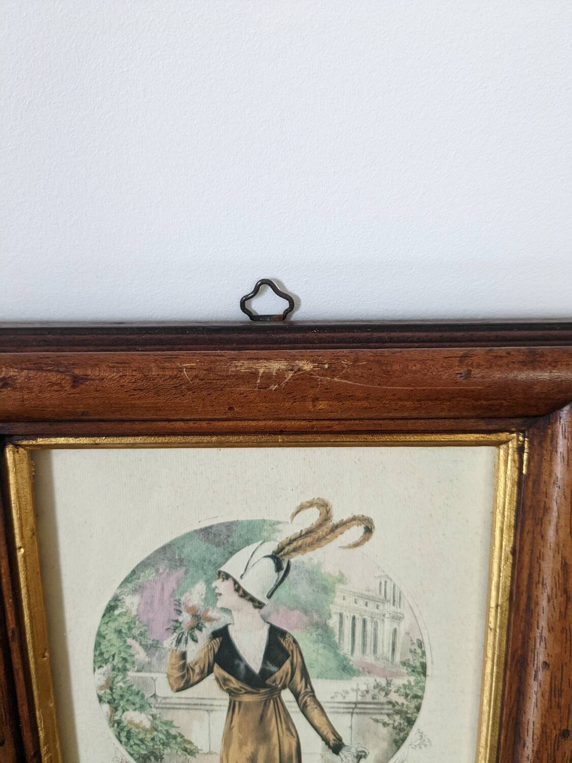 Two reproduction frames of engravings