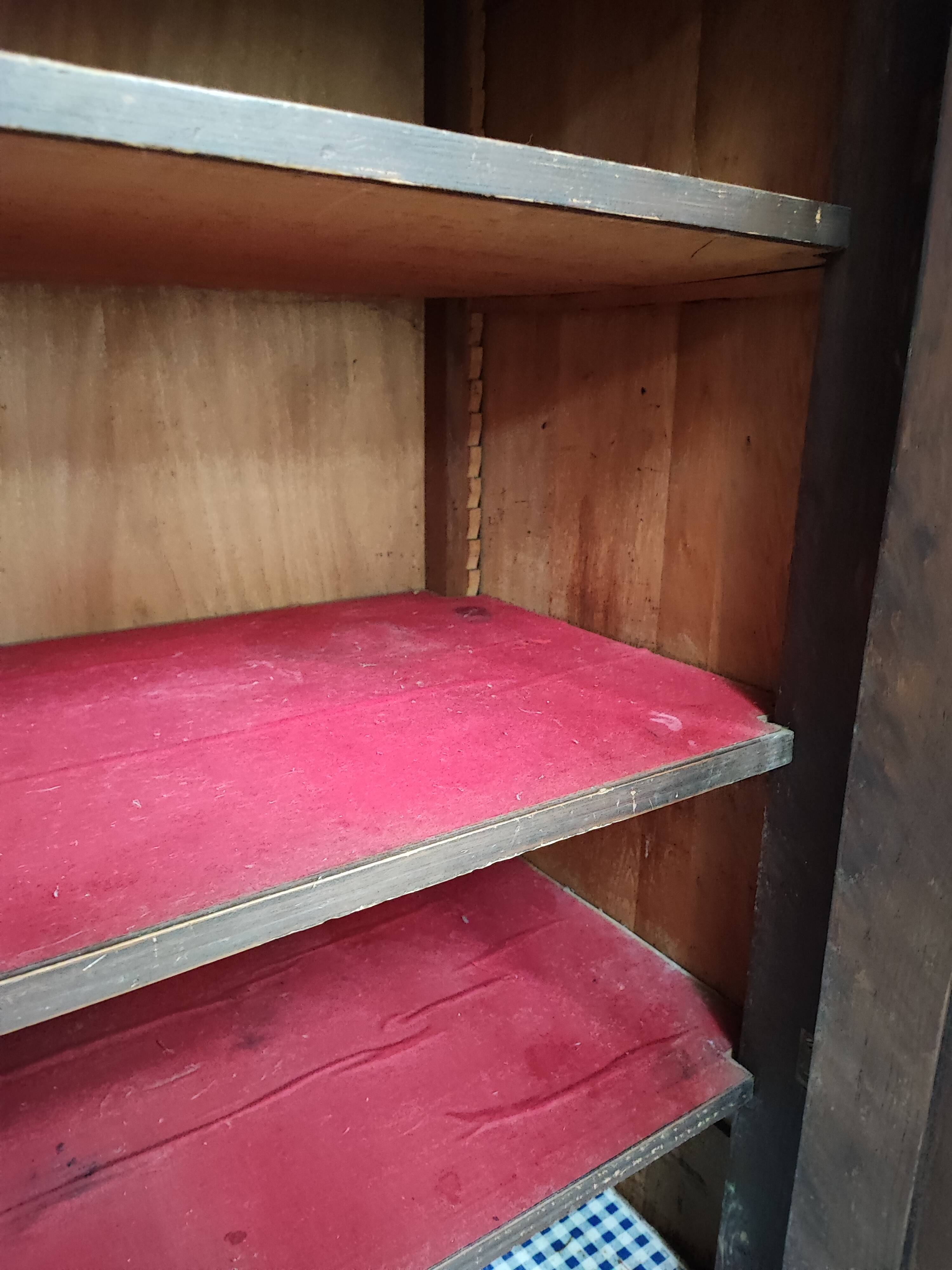 Bonnetière man standing cabinet a door