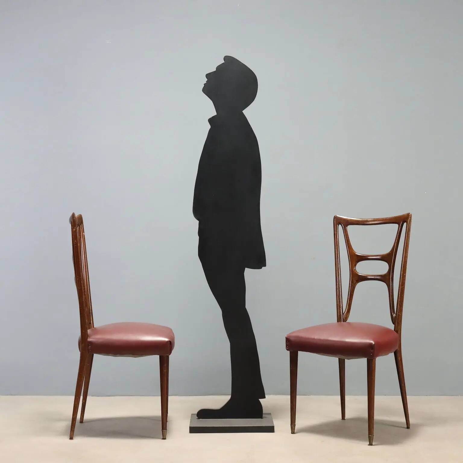 Set of six 1950s chairs with burgundy seats.