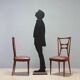 Set of six 1950s chairs with burgundy seats.