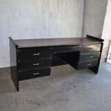 Hungarian Art Deco desk in black painted wood with a brown top and metal handles.