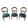 Set of three wooden Napoleon III chairs with carved decorations with blue velvet seat. Width 50c