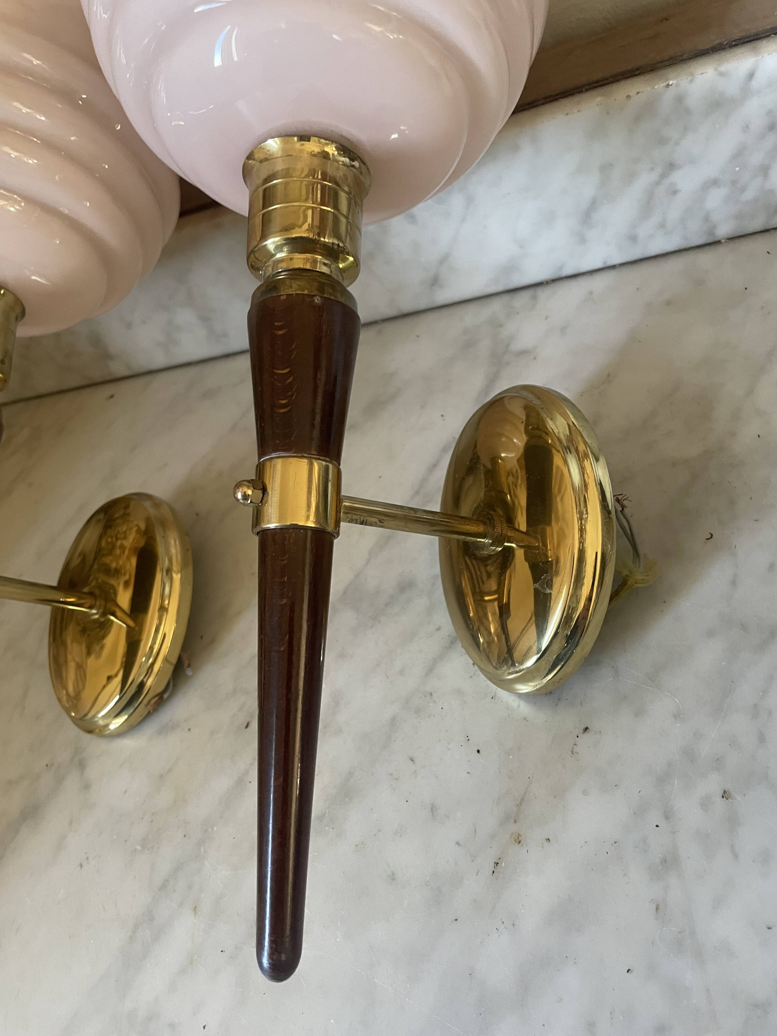 Pair of wall lights in wood, brass, and pink opaline.