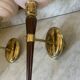 Pair of wall lights in wood, brass, and pink opaline.