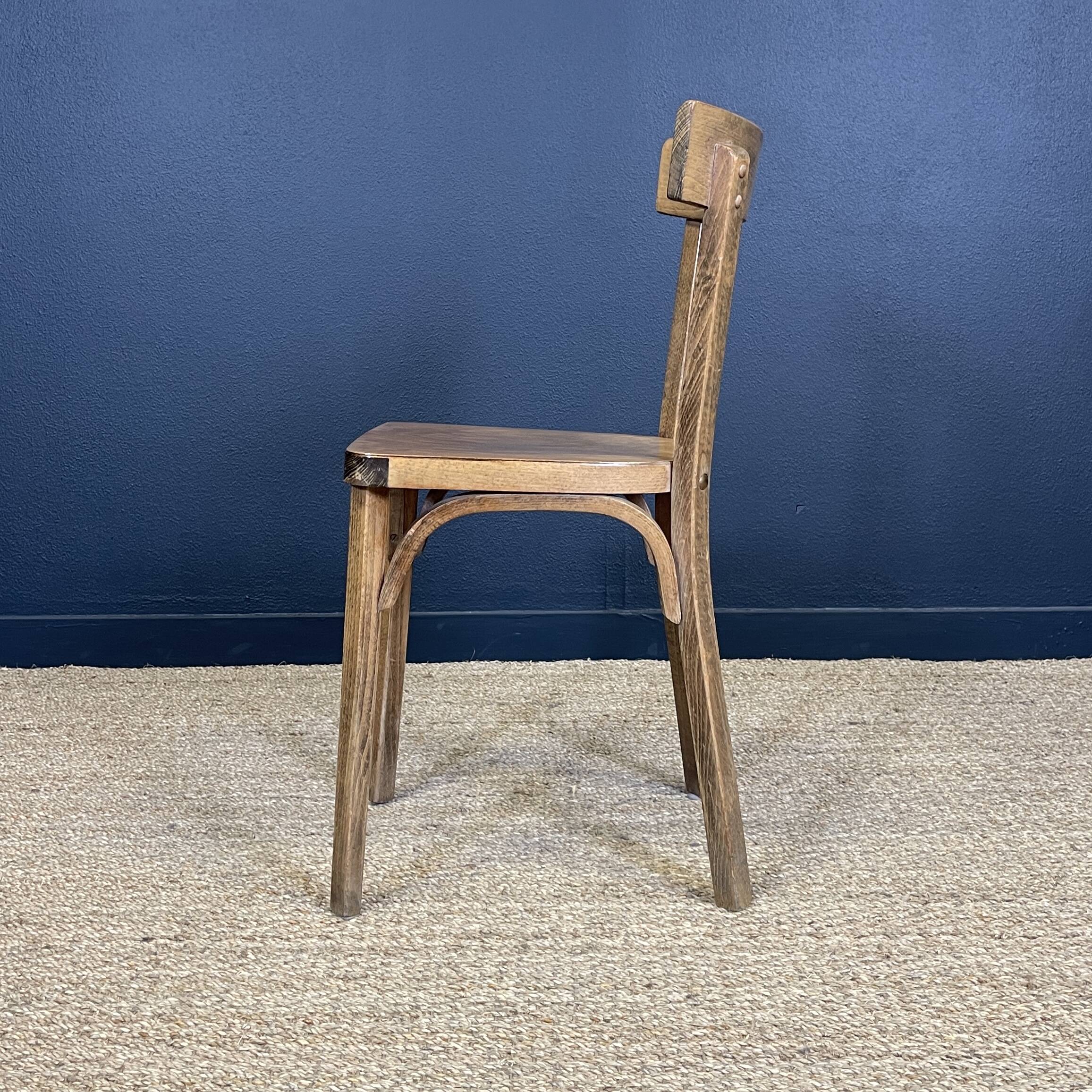 Set of 26 Baumann wooden bistro chairs from the 1950s France