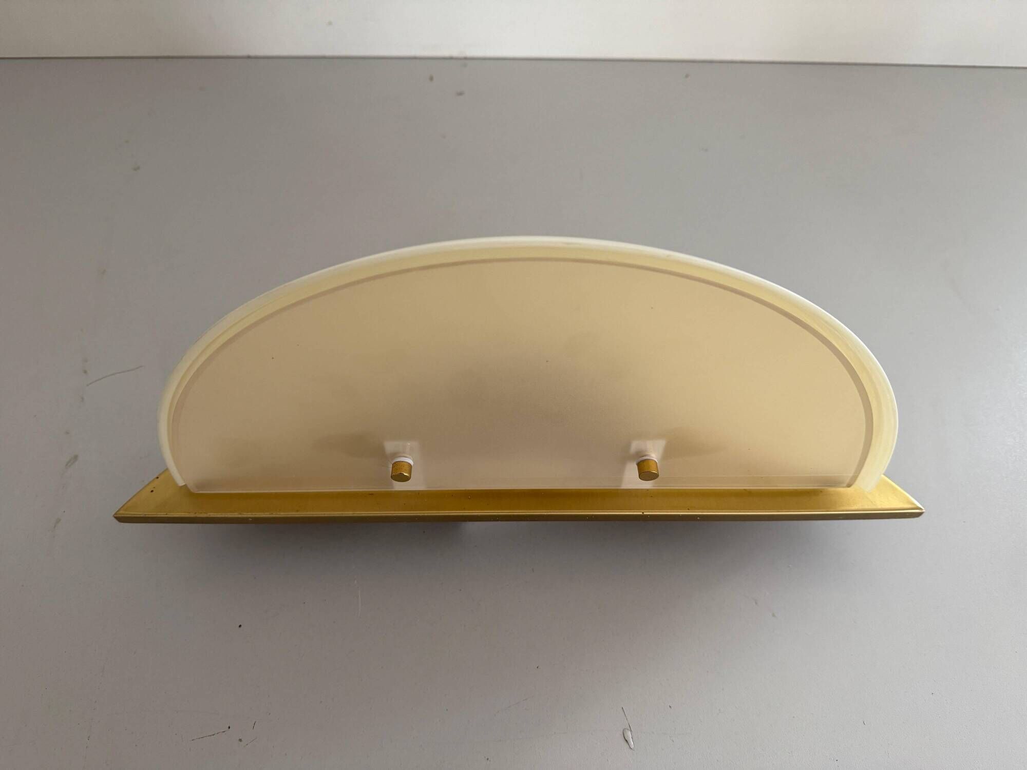 Pair of brass and glass wall lights from the Spage era, 1980, Germany.