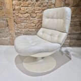 Fauteuil pivotant en cuir patiné gris