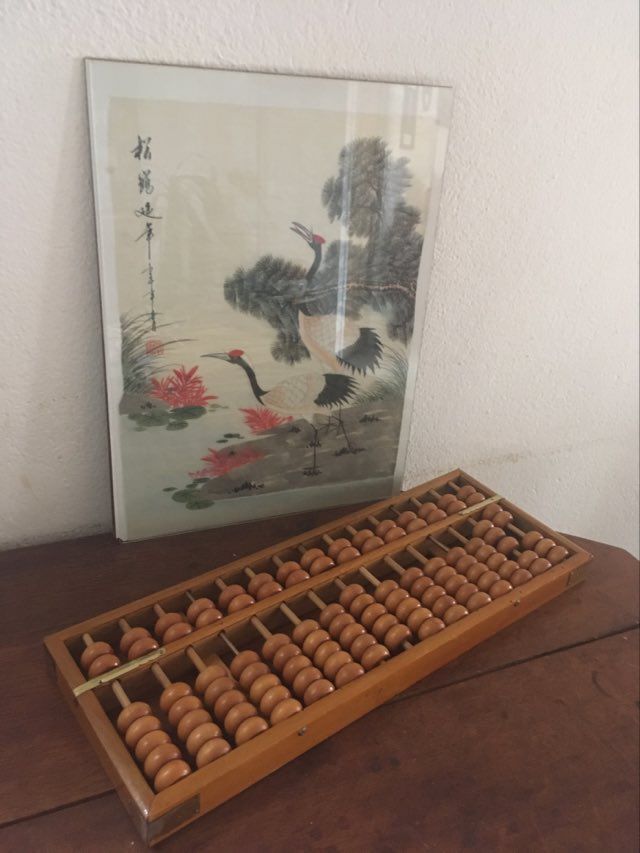 Vintage abacus made of light wood.