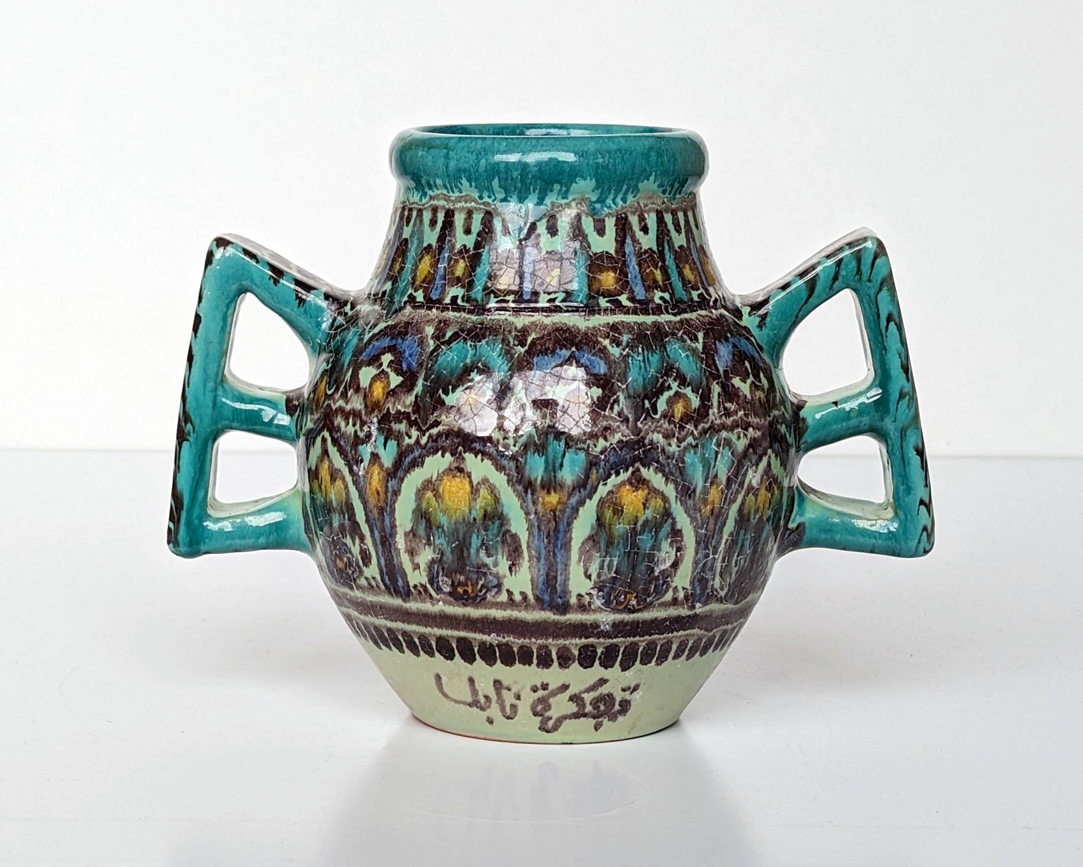 Polychrome ceramic vase in flowing enamel from Nabeul with mihrab decoration.