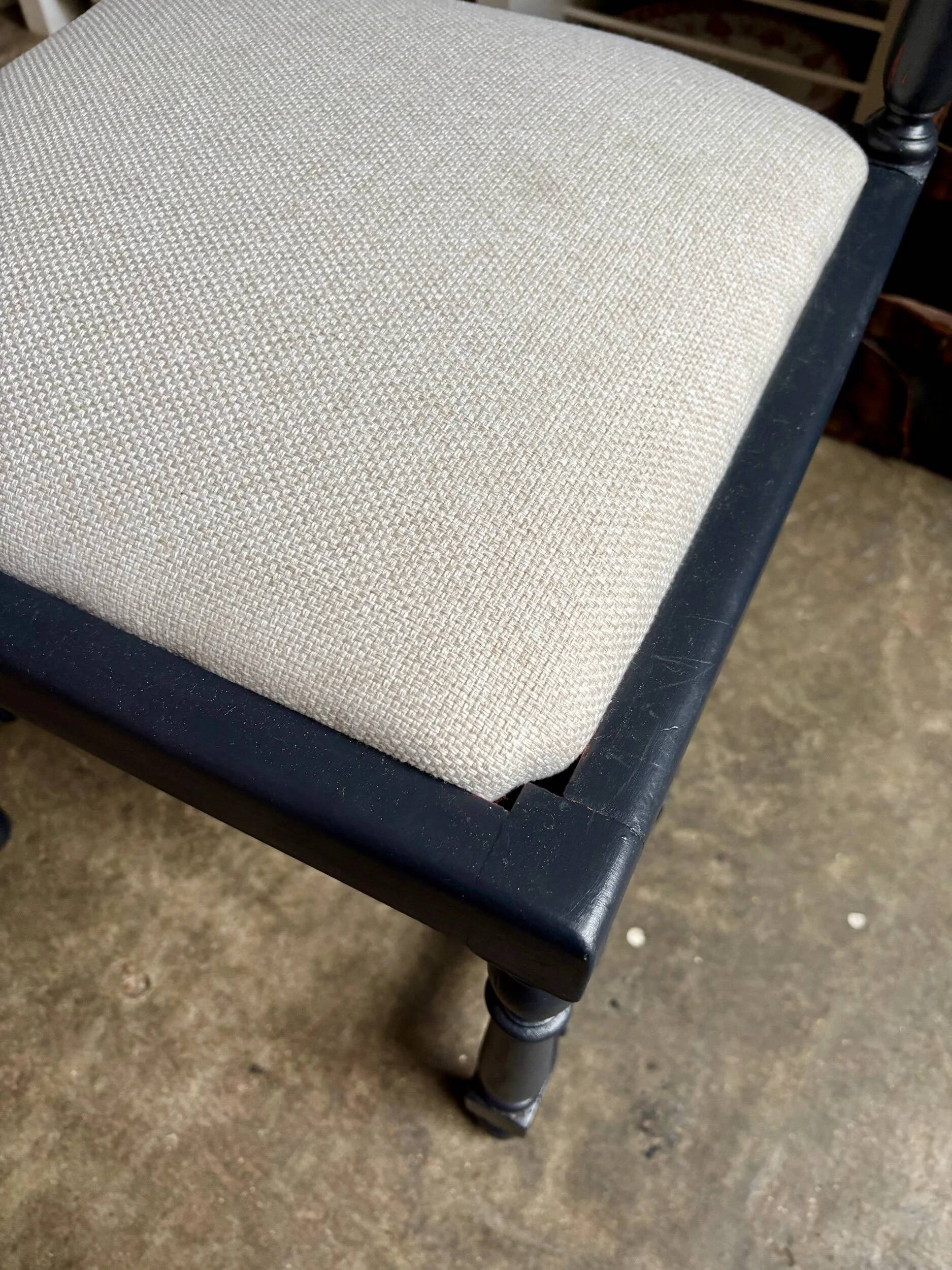Black turned wooden chair and ivory cotton.