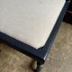 Black turned wooden chair and ivory cotton.