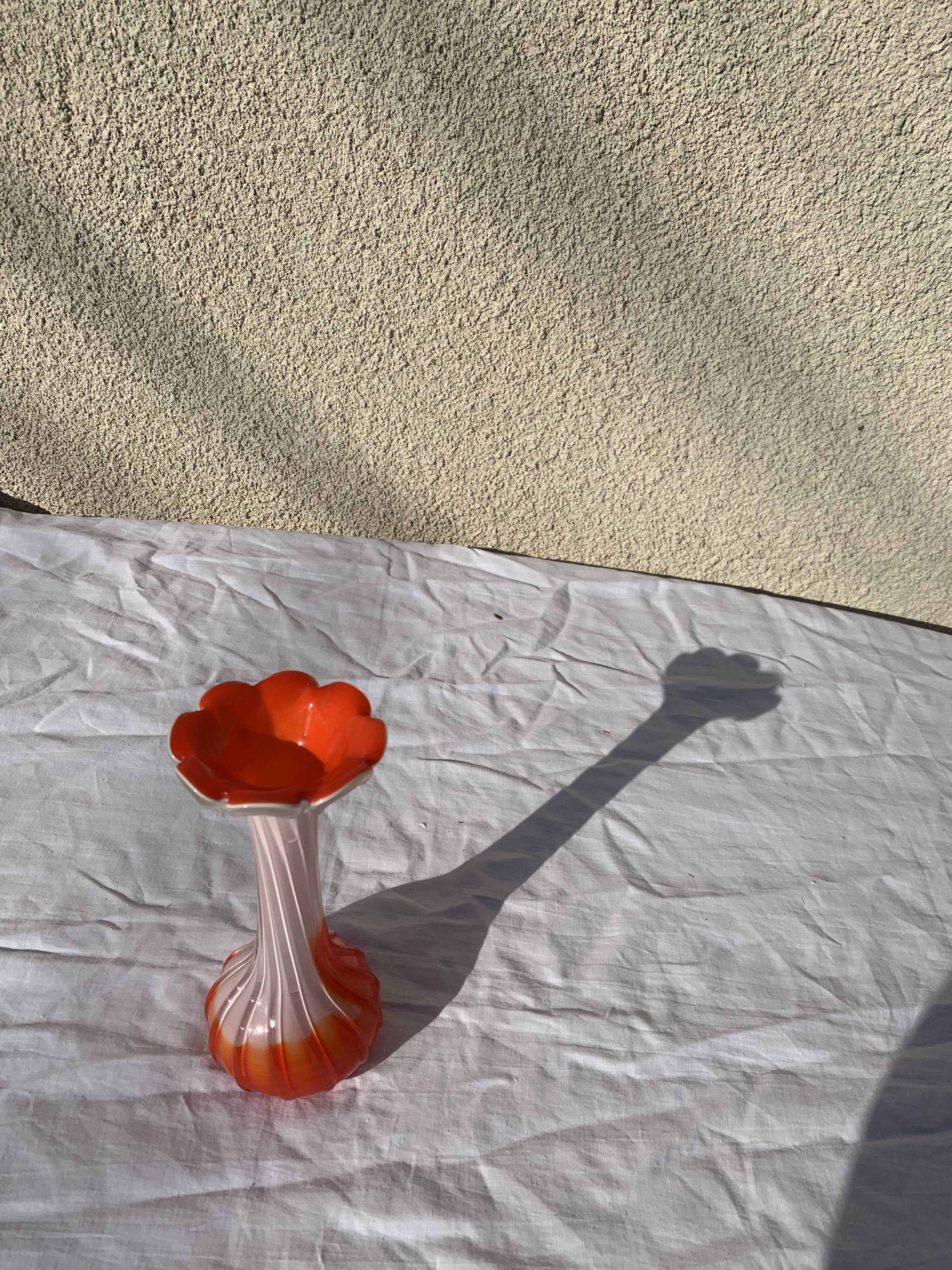 Orange and white opaline vase in the shape of a vintage flower corolla