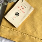 Old linen and cotton sheet tinted in curry yellow