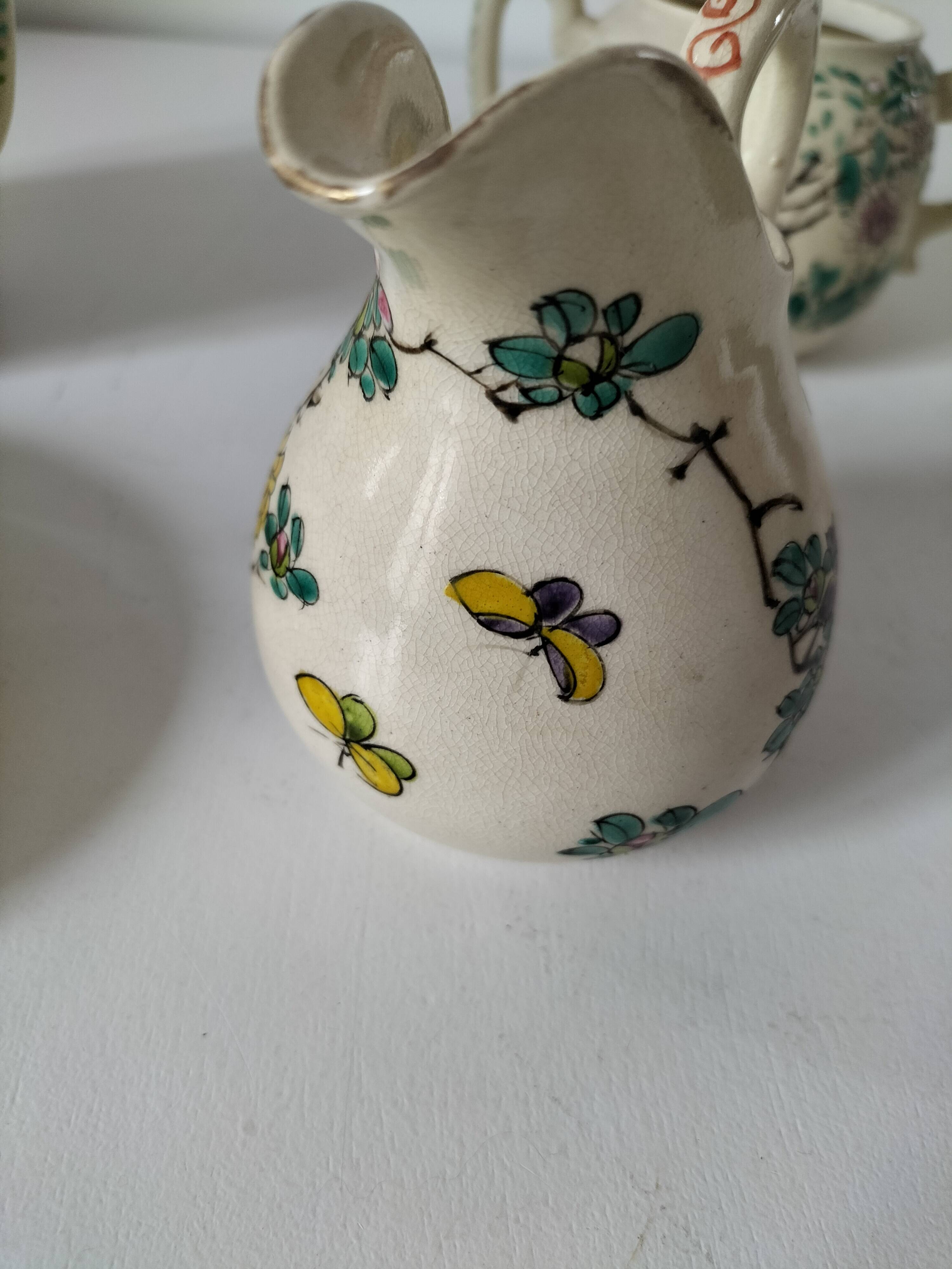 Japanese-style tea set in cracked earthenware with chrysanthemum flowers
