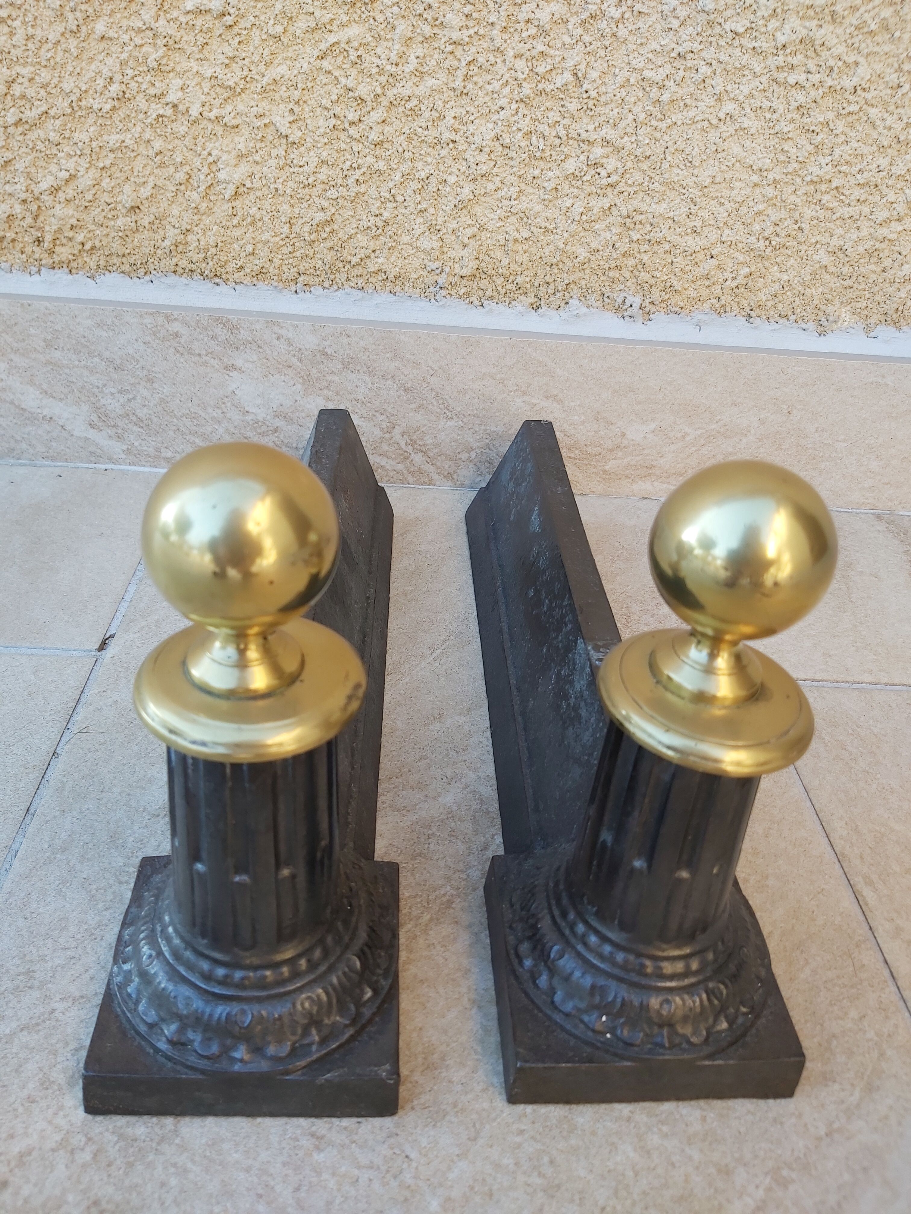 Pair of cast iron and bronze chenets