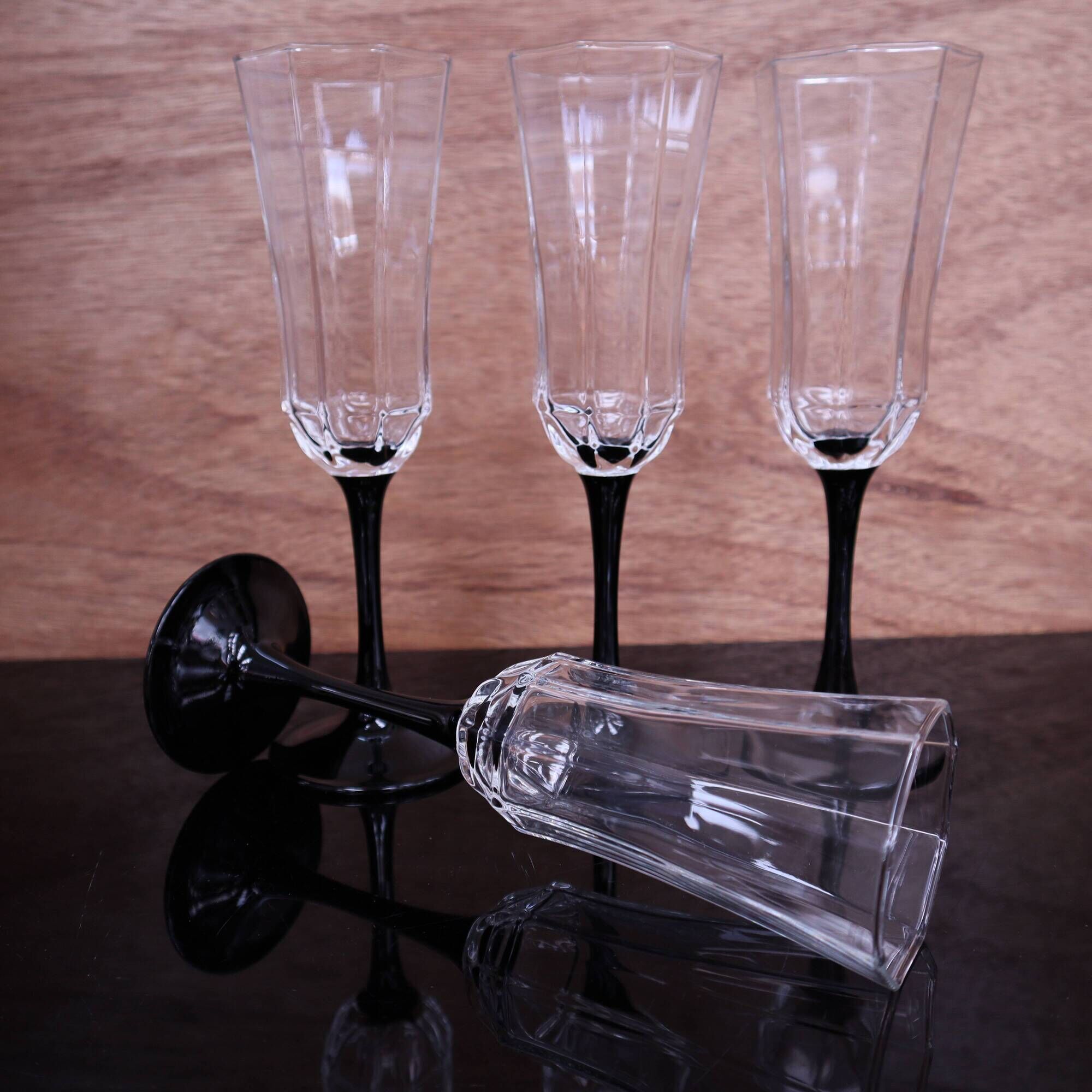4 octagonal black base Champagne flutes Octime