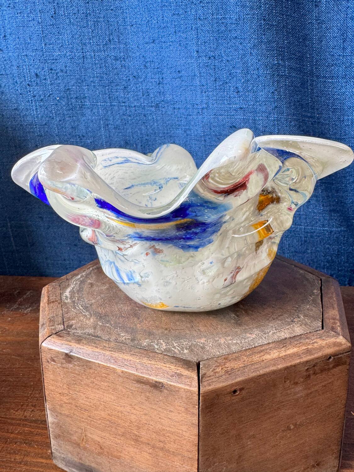 Multi-layer glass ashtray with metallic oxide inclusions.