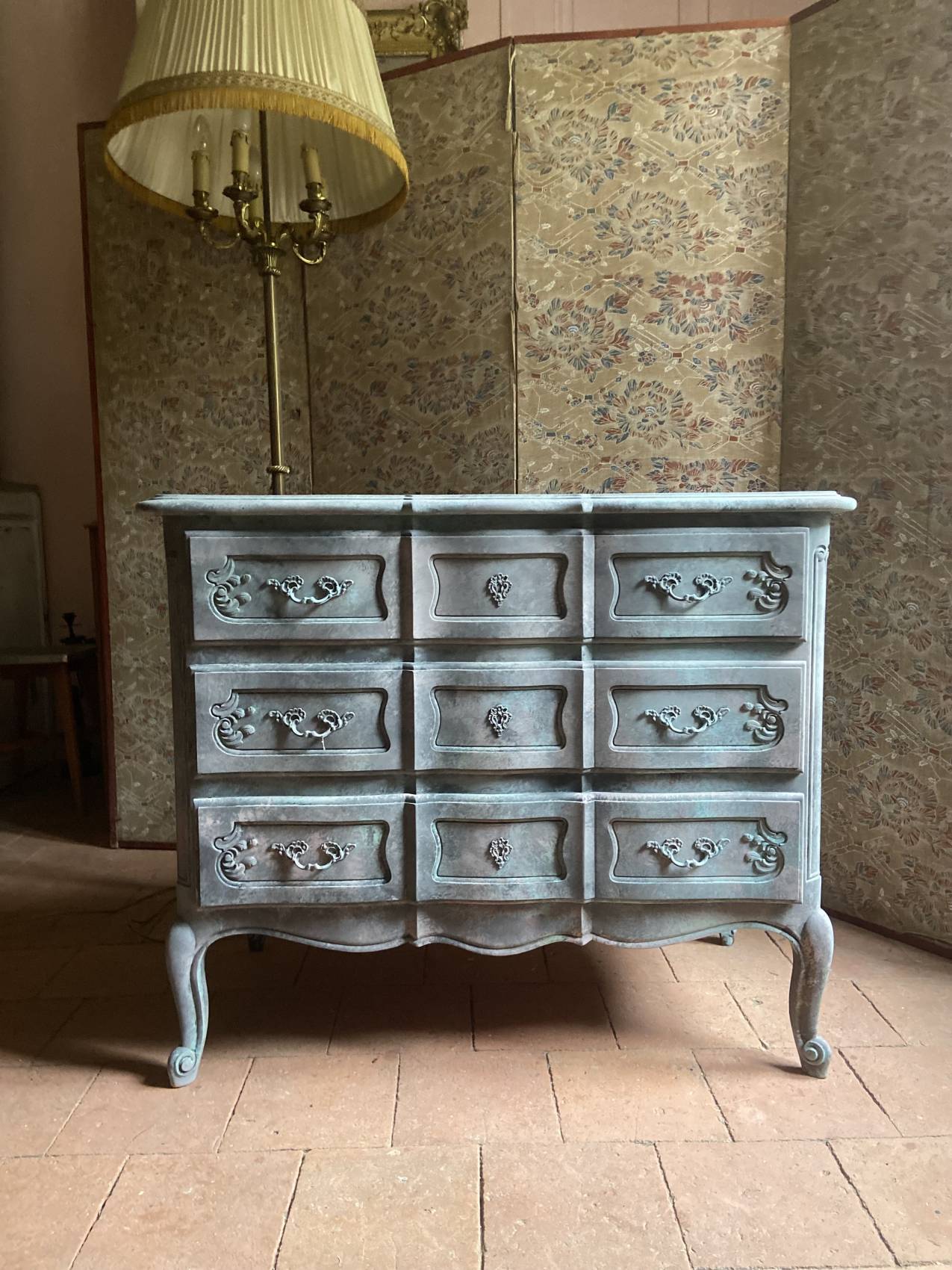 Antique Louis XV style commode, aged finish, practical elegance.