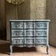 Antique Louis XV style commode, aged finish, practical elegance.