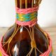 Vintage amber glass bottle scoubidou