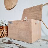 Small trunk in old wooden chest