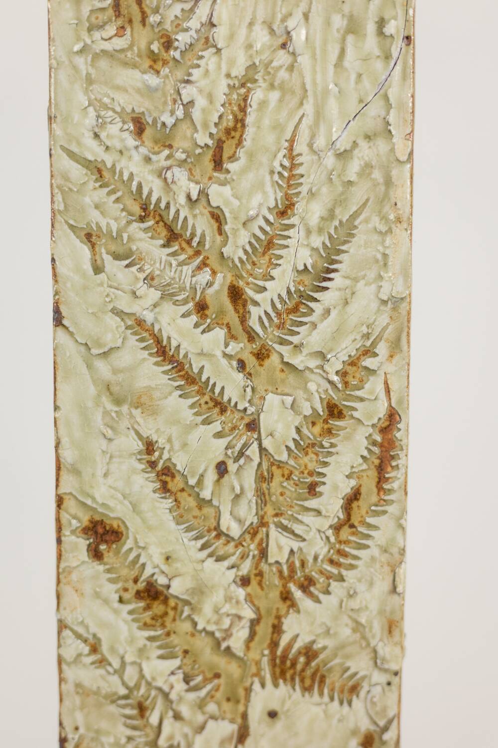 Brutalist stoneware vase with a plant motif. 1970s.