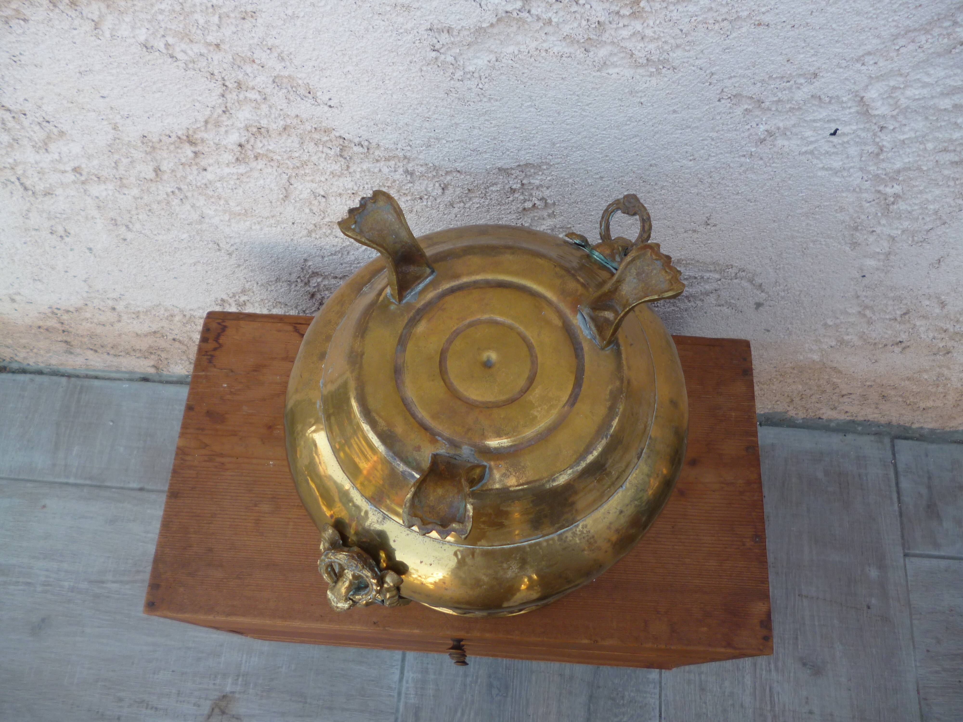 Antique lion heads brass pot cover