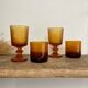 8 mismatched vintage amber glasses