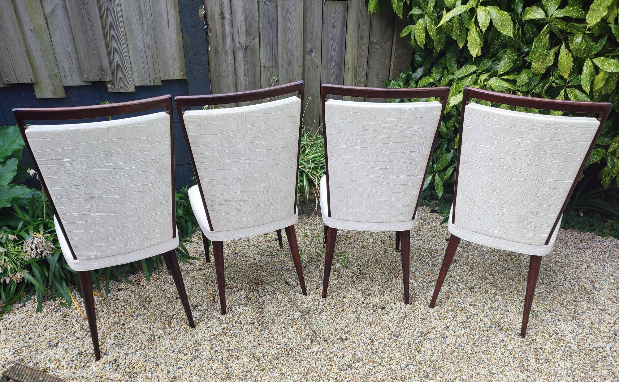 Set of 4 Vintage Mid-Century Modern Chairs with tapered metal legs.