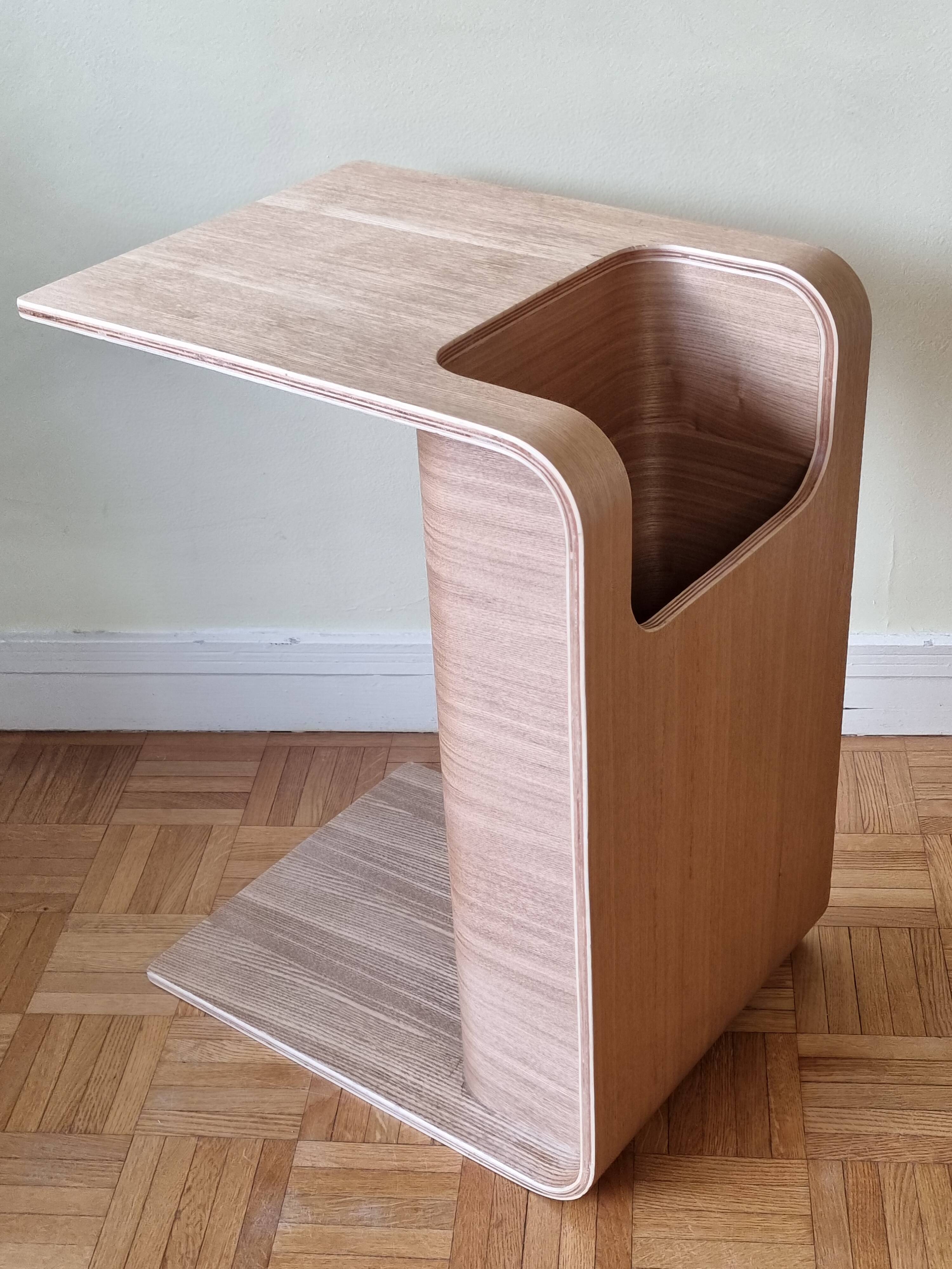 Boone coffee table in curved wood produced by Habitat, design