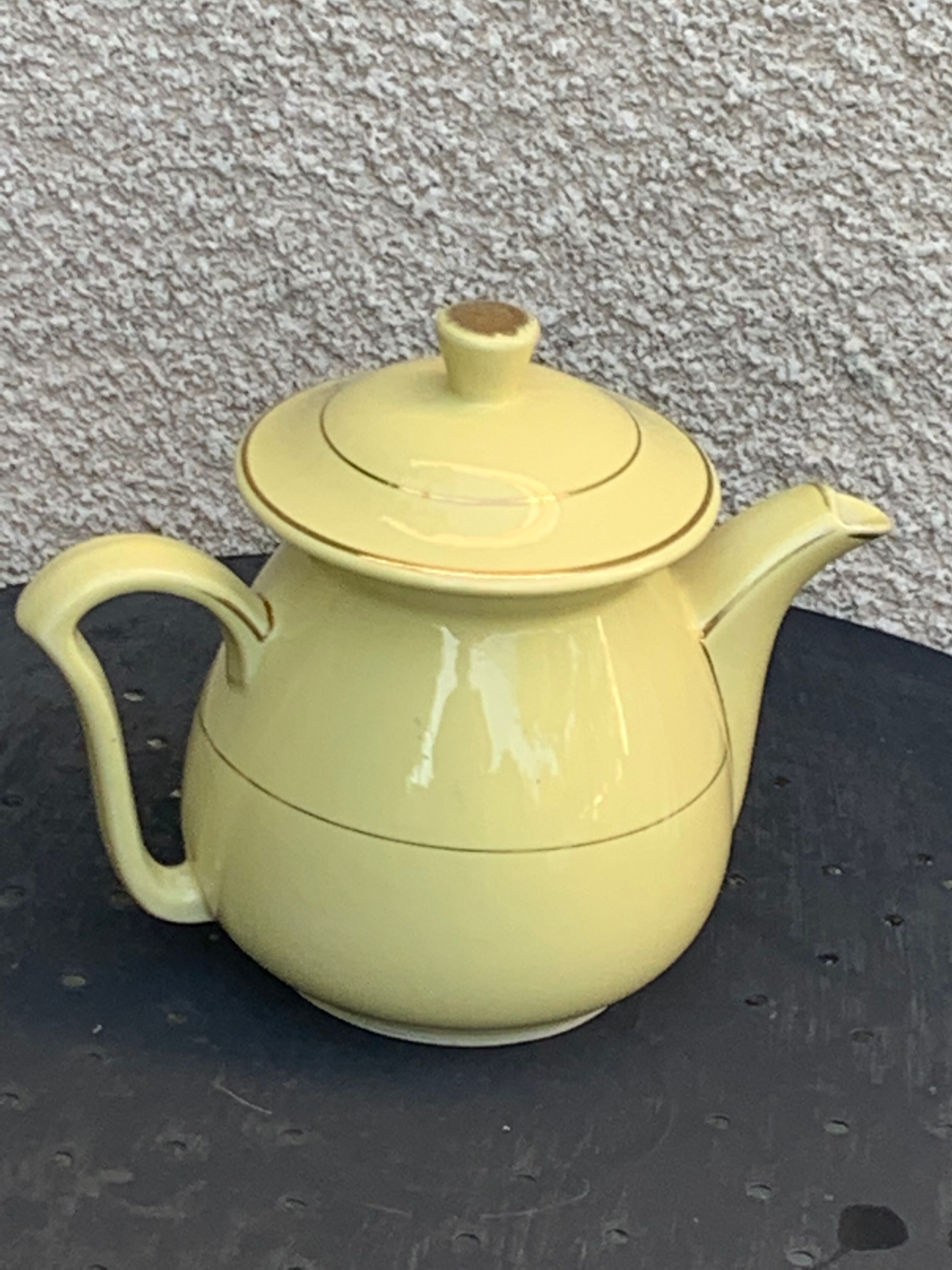 Teapot, yellow earthenware coffee maker and vintage gold edging