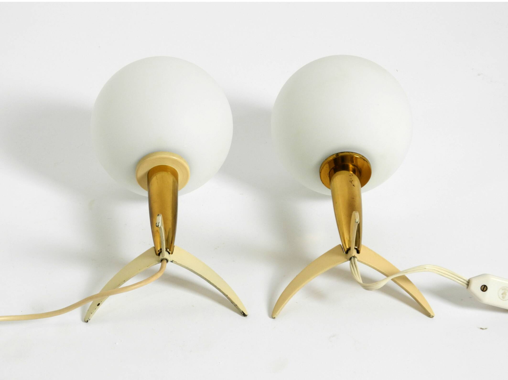 Two Mid-Century Modern rocket table lamps in brass and glass