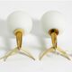 Two Mid-Century Modern rocket table lamps in brass and glass