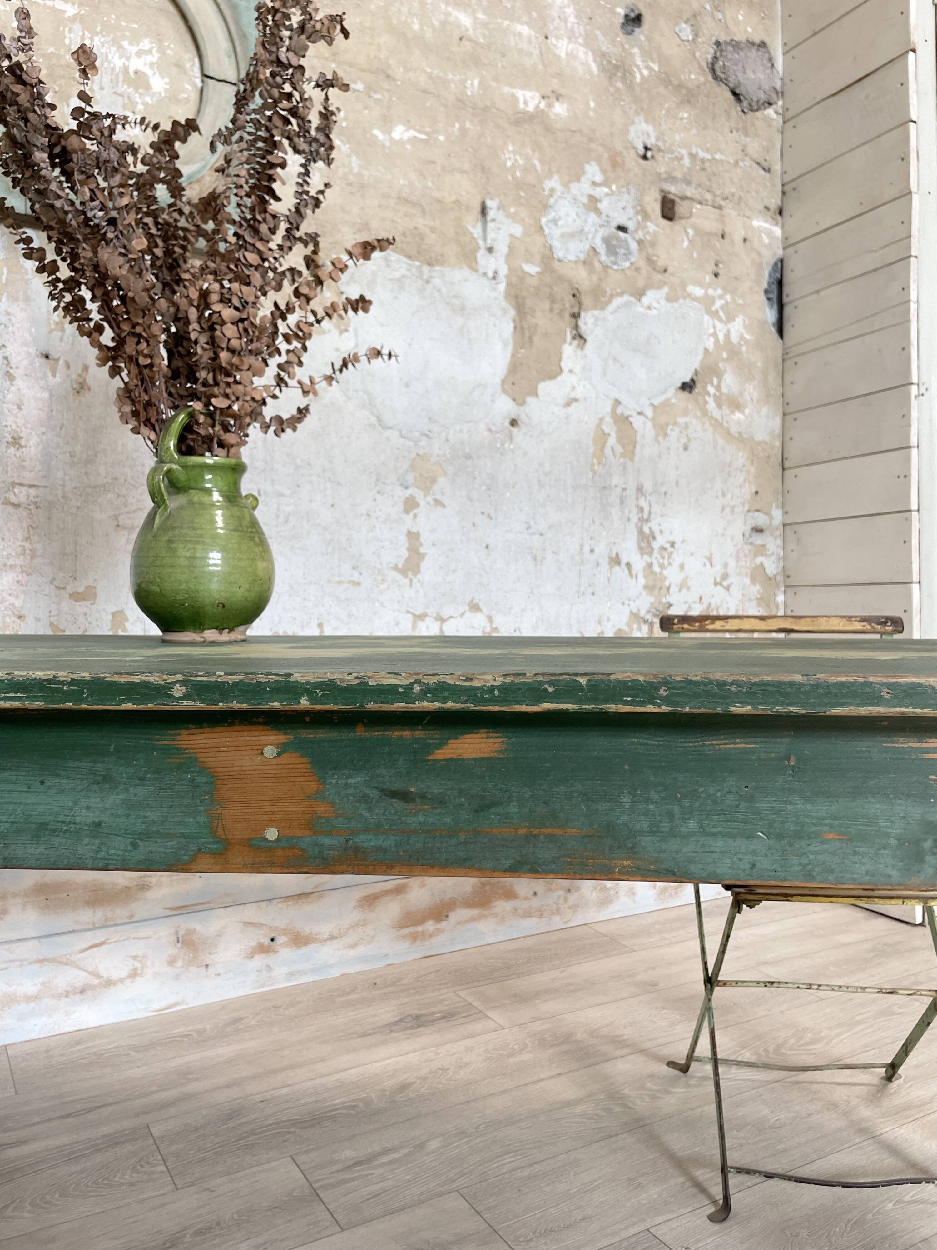 Vintage farm table with spindle legs.