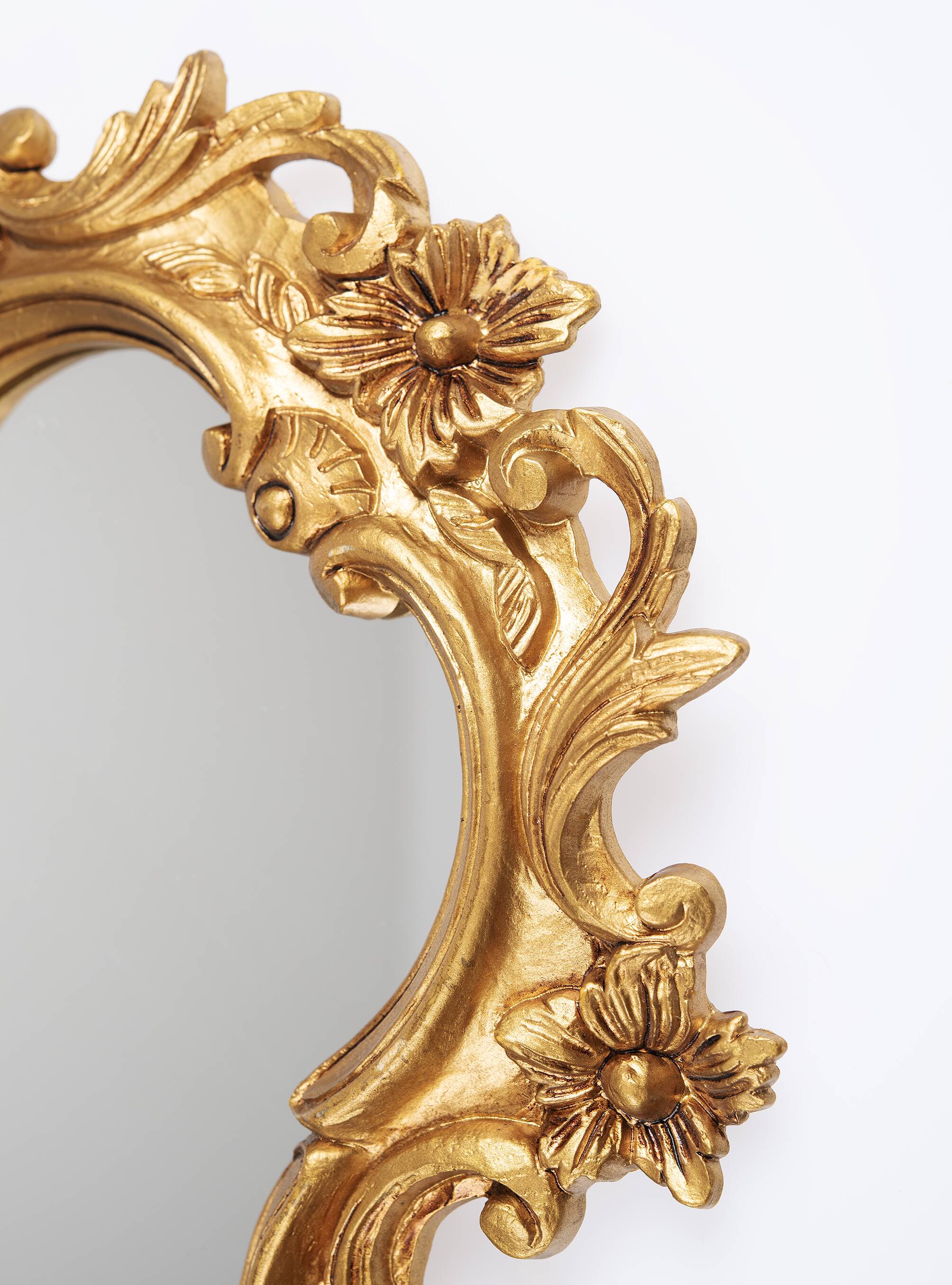 Baroque mirror in golden resin
