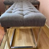 Pair of benches in chrome metal and padded gray fabric