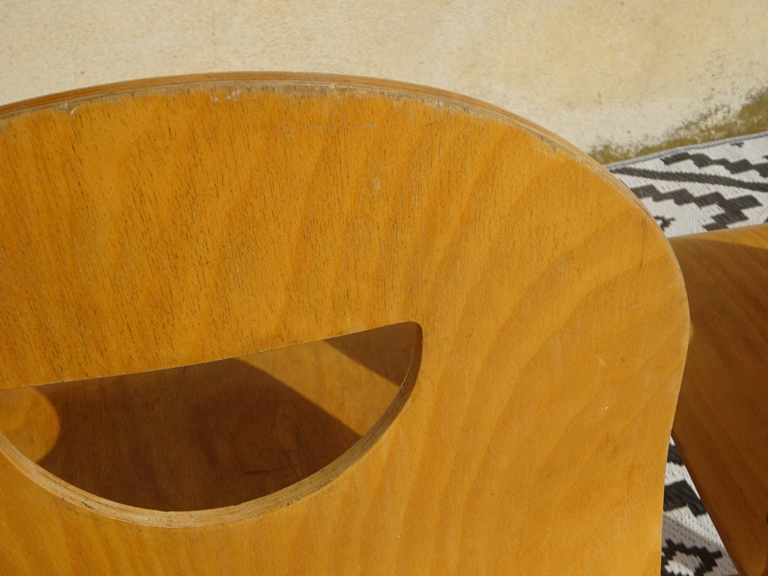 Pair of light wood chairs with post-formed seat and backrest.