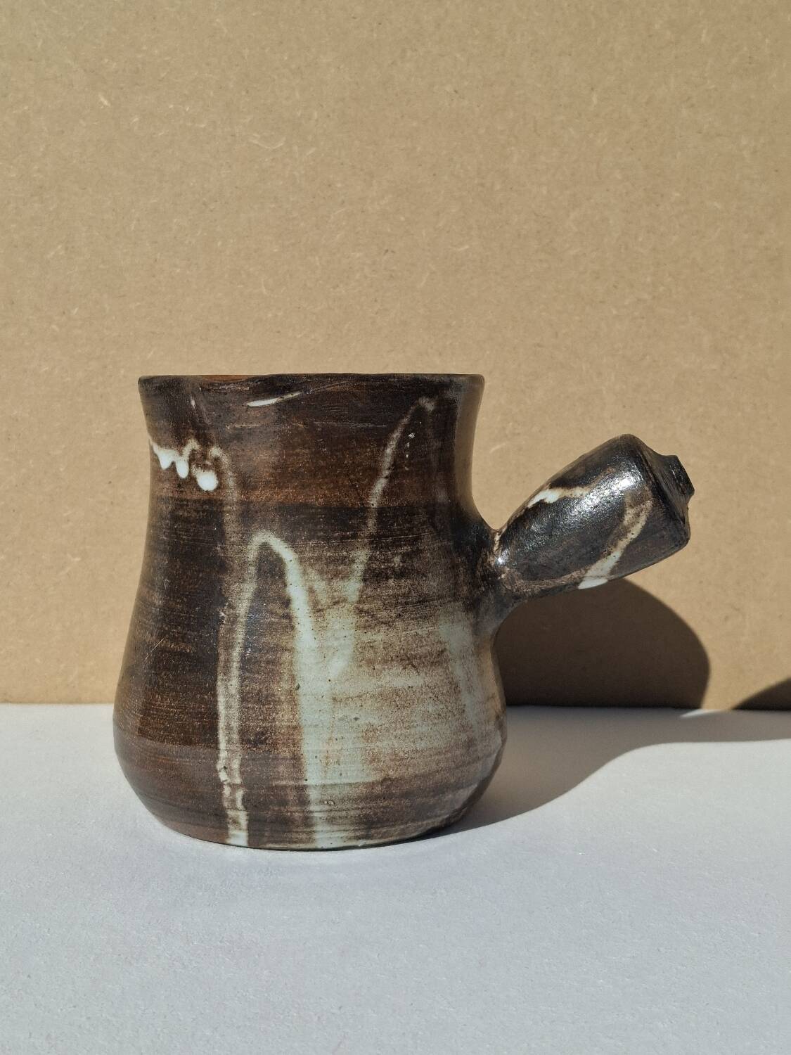 Stoneware pitcher signed by Jacques Pouchain.