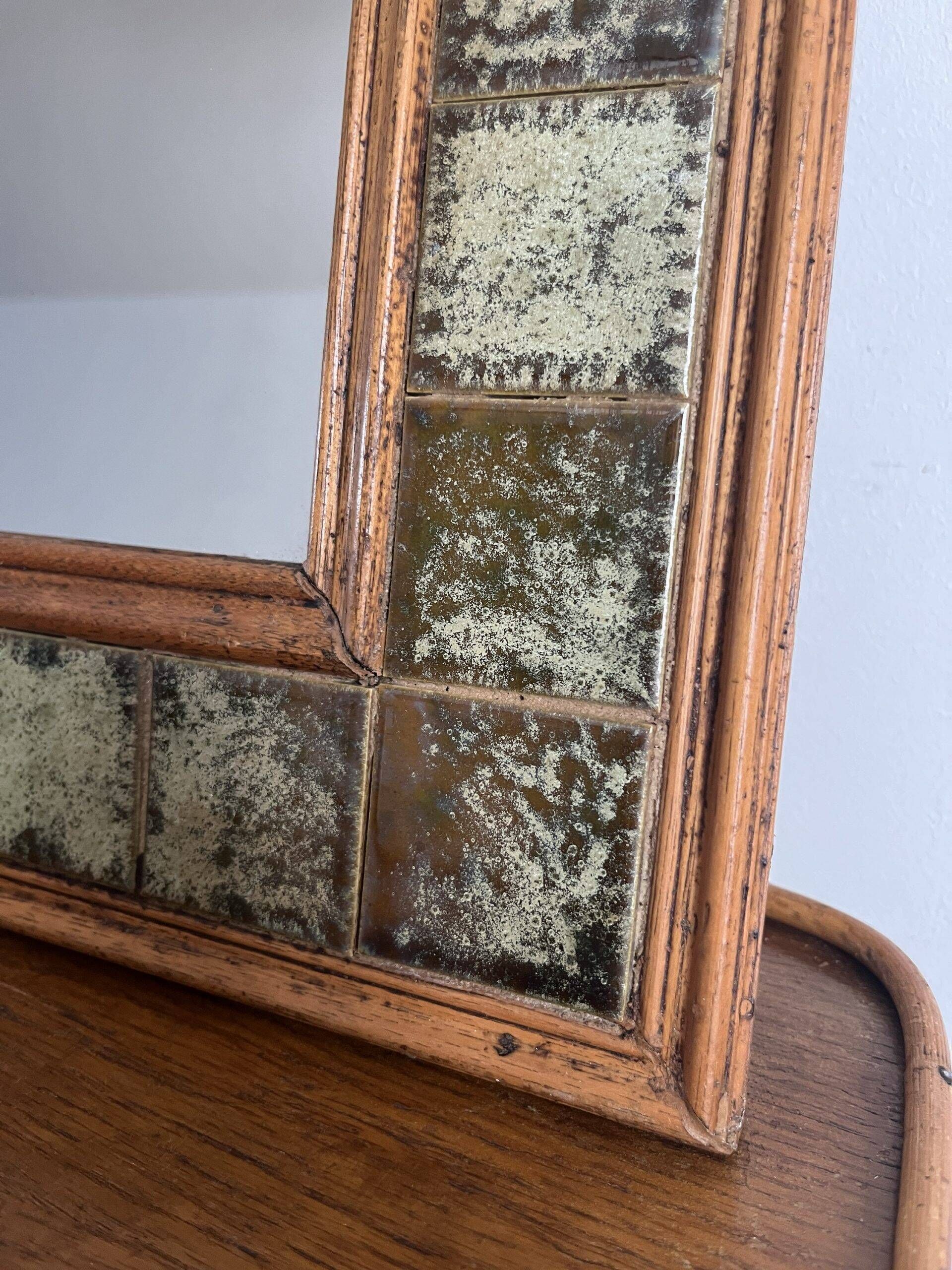 Vintage wall mirror in wood and ceramic tiles