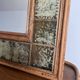 Vintage wall mirror in wood and ceramic tiles