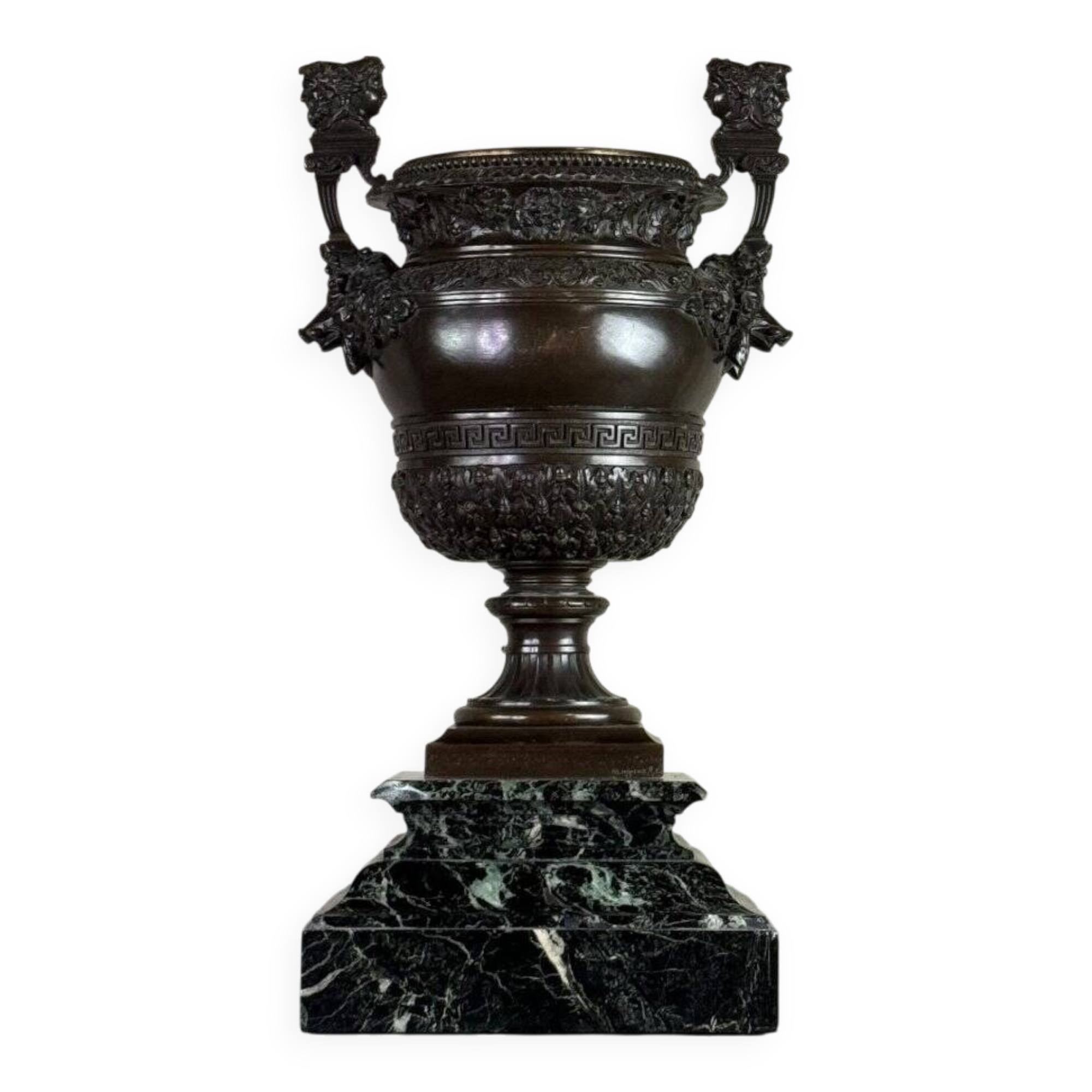 Patinated bronze vase with handles topped by bicéphalic busts, 19th century.
