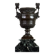 Patinated bronze vase with handles topped by bicéphalic busts, 19th century.