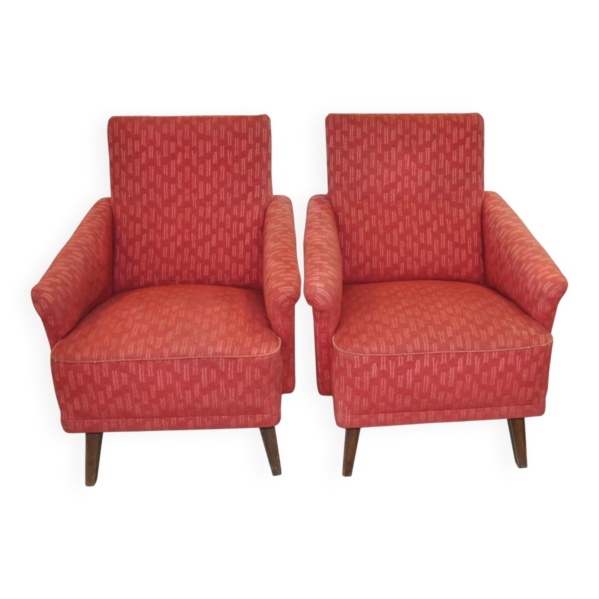 Pair of Mid-Century armchairs in red and brown fabric with dark wooden legs.