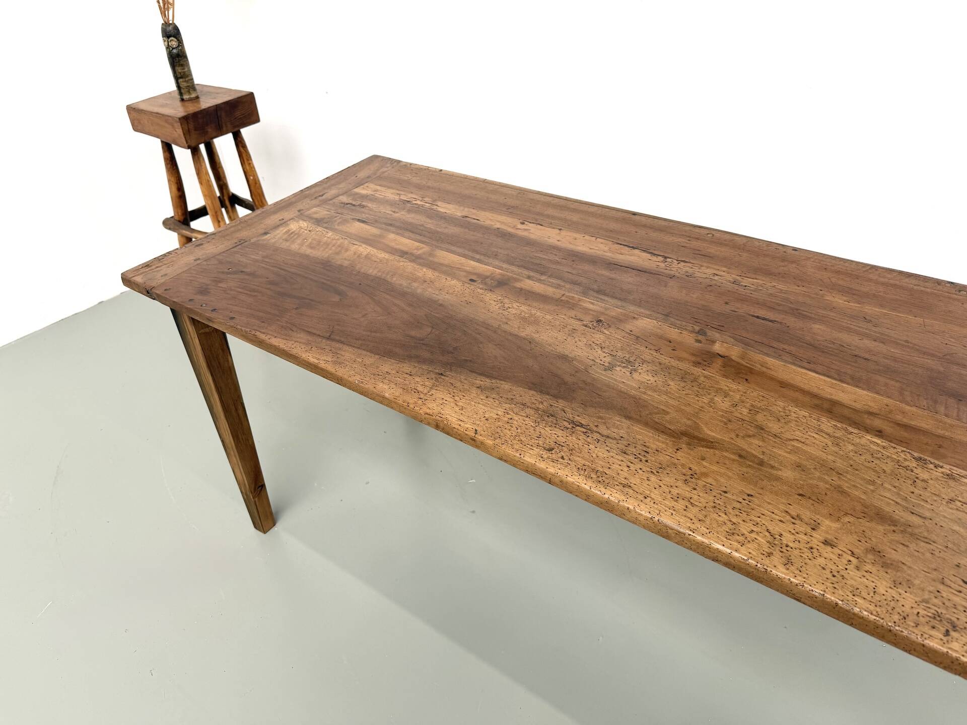 Farm table in walnut with spindle legs.