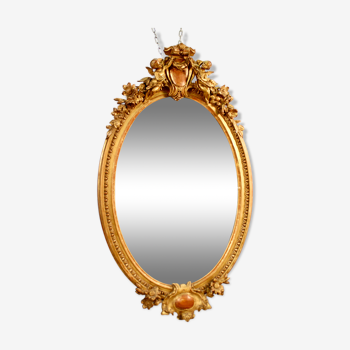 Miroir ovale à décor de putti - 129x75cm