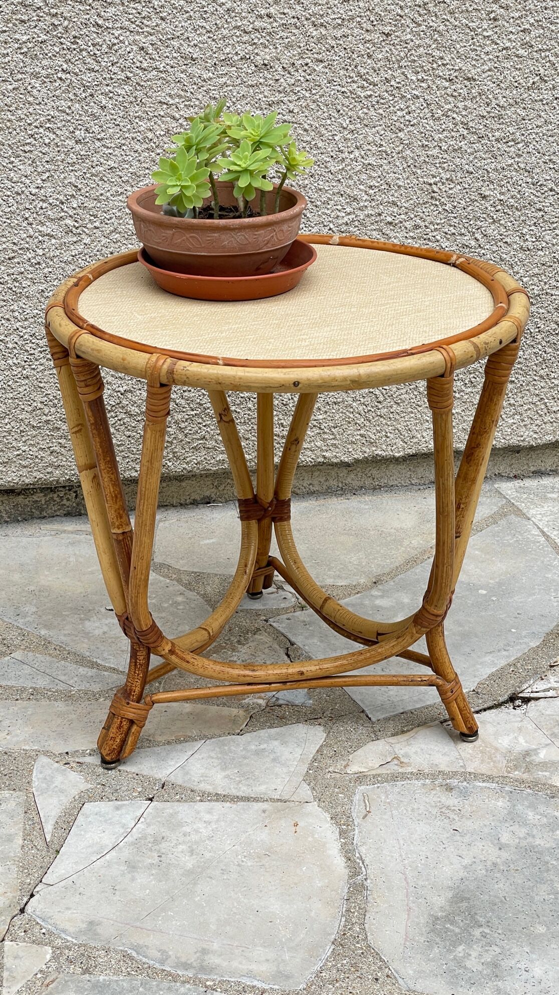 Round coffee table in vintage rattan
