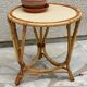 Round coffee table in vintage rattan