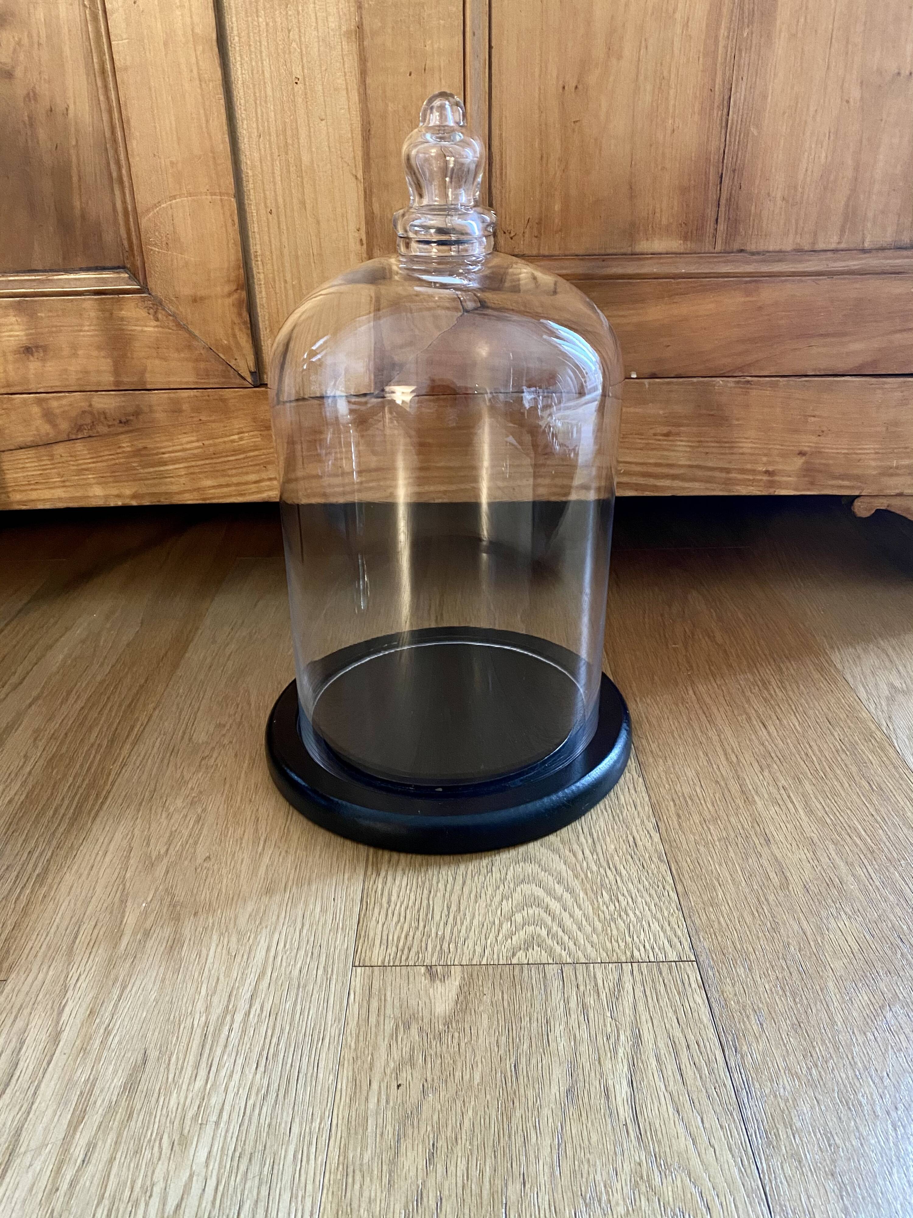 Large old glass bell and its wooden base